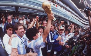 JUL 1986:  DIEGO MARADONA OF ARGENTINA LIFTS THE WORLD CUP TROPHY IN FRONT OF THE WORLD's MEDIA AFTER ARGENTINA BEAT GERMANY 3-2 TO WIN  THE 1986 SOCCER WORLD CUP FINAL. Mandatory Credit: Mike King/ALLSPORT
