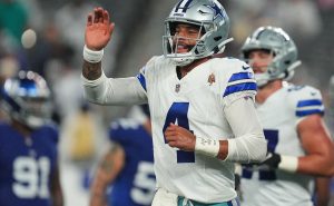 EAST RUTHERFORD, NEW JERSEY – SEPTEMBER 10: Dak Prescott #4 of the Dallas Cowboys reacts after a touchdown run by KaVontae Turpin #9 during the fourth quarter against the New York Giants at MetLife Stadium on September 10, 2023 in East Rutherford, New Jersey. (Photo by Mitchell Leff/Getty Images)
